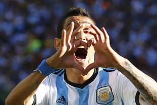 Argentina's Di Maria celebrates scoring against Switzerland during extra time in their 2014 World Cup round of 16 game in Sao Paulo