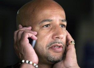 File photo of Mayor Nagin talking on a mobile phone as he waits for rain to subside at the Superdome in New Orleans