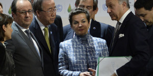 UN climate chief Christiana Figueres (C) speaks with French President Francois Hollande (L), United Nations Secretary General Ban Ki-moon (2ndL) and French Foreign Minister Laurent Fabius (R) after a statement at the COP21 Climate Conference in Le Bourget, north of Paris, on December 12, 2015. The years-long quest for a universal pact to avert catastrophic climate change neared the finish line today with conference host France announcing that the final draft had been completed in the early hours of the morning. AFP PHOTO / MIGUEL MEDINA