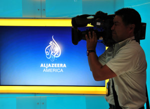 A television cameraman takes video of the new Al Jazeera America television broadcast studio on West 34th Street August 16, 2013 in New York. Al Jazeera America, which will launch on August 20, will have its headquarters in New York. AFP PHOTO/Stan HONDA        (Photo credit should read STAN HONDA/AFP/Getty Images)