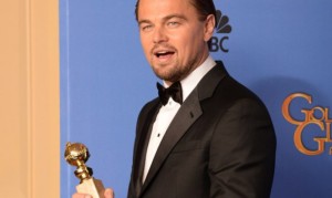 Actor Leonardo DiCaprio celebrates winning Best Actor in a Motion Picture - Musical or Comedy for "The Wolf of Wall Street" in the press room during the 71st Annual Golden Globe Awards in Beverly Hills, California, January 12, 2014.   AFP PHOTO / Robyn BECK / AFP / ROBYN BECK