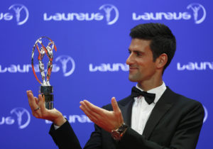 Tennis player Novak Djokovic of Serbia poses with his Laureus World Sportsman of the Year award during the Laureus World Sports Awards 2016 in Berlin, Germany, April 18, 2016. REUTERS/Hannibal Hanschke