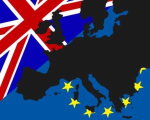 40649817 - power struggle between the uk and europe the black map of europe has been deposited with the flags of britain and europe